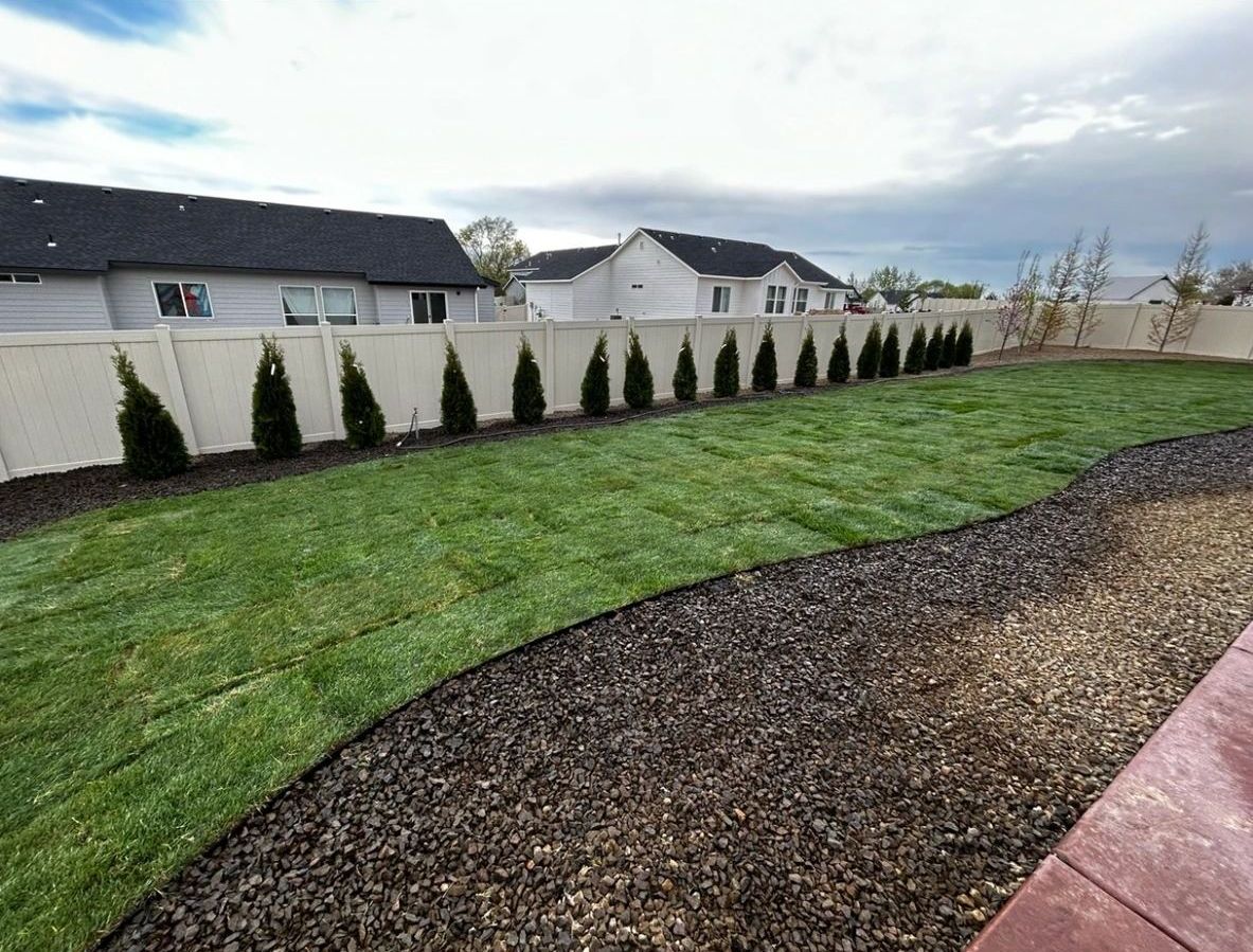 Backyard landscaping and fence in Nampa ID